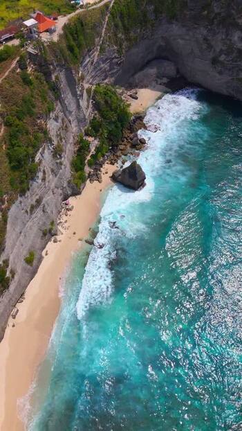 Aerial view of Diamond Beach with turquoise waves and limestone cliffs Indonesia. Aerial view of Diamond Beach with turquoise waves and limestone cliffs Indonesia.