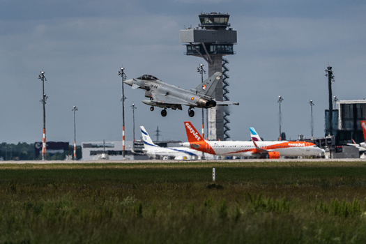 Berlin Germany 13 June 2026 View of a Eurofighter Typhoon performing a flight display at the ILA Berlin Air Show with the airport control tower and parked airliners. Berlin Germany 13 June 2026 View of a Eurofighter Typhoon performing a flight display at the ILA Berlin Air Show with the airport control tower and parked airliners.