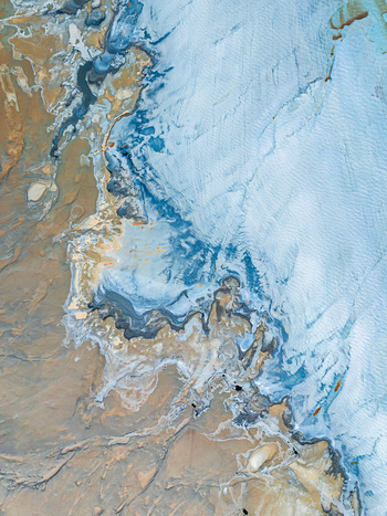 Aerial view of intricate salt flats and mineral deposits with swirling patterns of blue white and brown earth in Andalusia Spain. Aerial view of intricate salt flats and mineral deposits with swirling patterns of blue white and brown earth in Andalusia Spain.