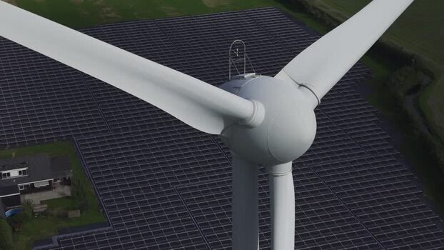Aerial view of wind turbine and solar farm Netherlands.