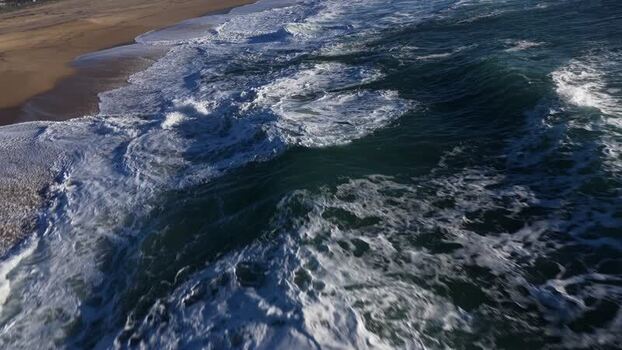 Aerial view of beach and ocean waves Portugal.