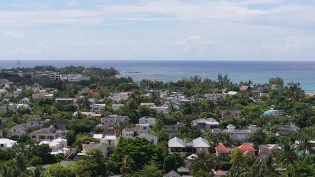 Aerial view of Grand Baie Public Beach and coastal town Mauritius.