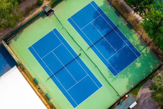 Aerial view of blue tennis field in Warsaw Masovian Voivodeship Poland. Aerial view of blue tennis field in Warsaw Masovian Voivodeship Poland.