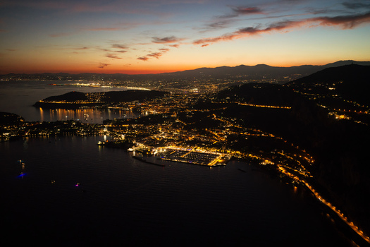 Aerial view of the illuminated French Riviera coastline at night featuring the town of Eze a marina and coastal lights Eze Provence Alpes Cote d Azur France. Aerial view of the illuminated French Riviera coastline at night featuring the town of Eze a marina and coastal lights Eze Provence Alpes Cote d Azur France.