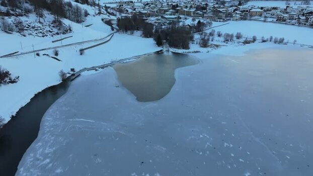 Aerial view of frozen Reschensee in Graun im Vinschgau Italy. Aerial view of frozen Reschensee in Graun im Vinschgau Italy.