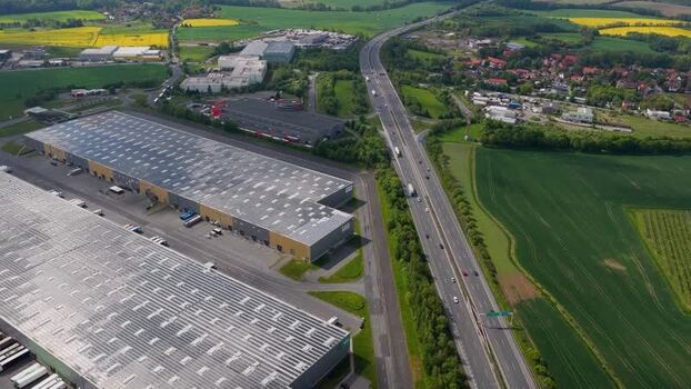 Aerial view of industrial warehouses and a highway Czechia.