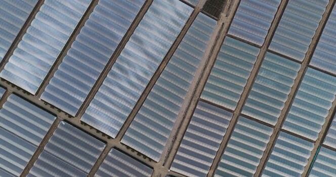 Aerial view of greenhouses in a geometric grid pattern Italy.