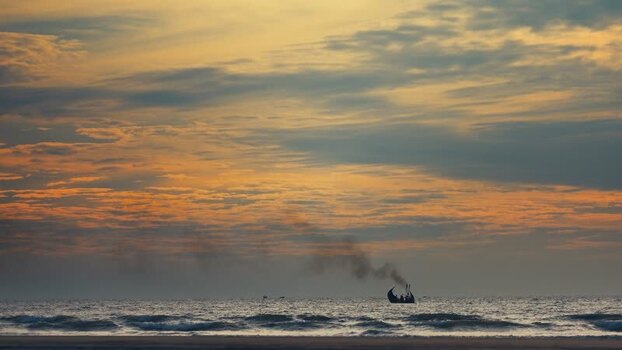 View of a traditional fishing boat at sunset Bangladesh. View of a traditional fishing boat at sunset Bangladesh.