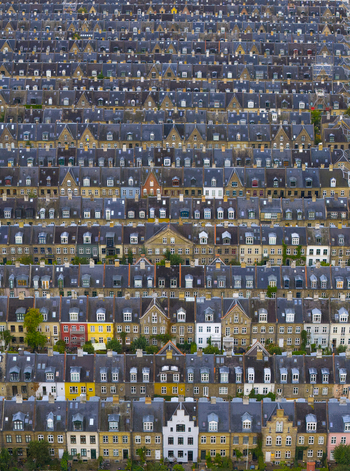Aerial view of the historic Kartoffelraekkerne terraced houses with repetitive gabled rooftops and colorful facades in Copenhagen Denmark. Aerial view of the historic Kartoffelraekkerne terraced houses with repetitive gabled rooftops and colorful facades in Copenhagen Denmark.
