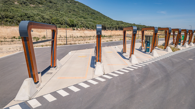 Malataverne Auvergne Rhone Alpes France 06 July 2026 Aerial view of the Milence electric truck charging hub with wooden structures and concrete bays in a rural logistics facility.