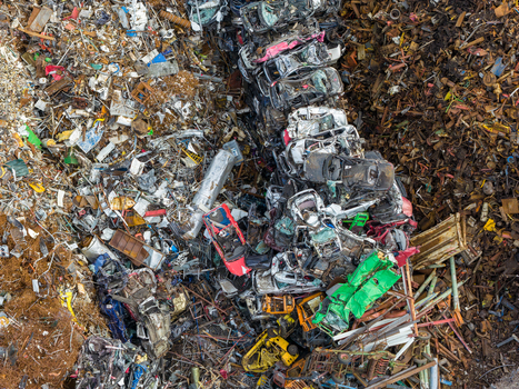 Aerial view of scrapped cars and crushed metal debris piled in a junkyard and recycling site in Hoogeveen Drenthe Netherlands. Aerial view of scrapped cars and crushed metal debris piled in a junkyard and recycling site in Hoogeveen Drenthe Netherlands.