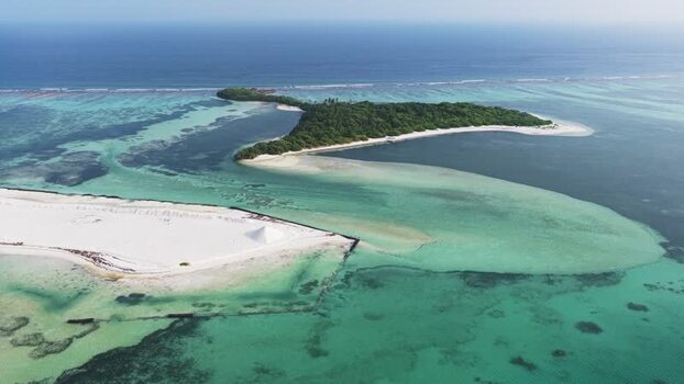 Aerial view of a tropical island and turquoise lagoon Maldives. Aerial view of a tropical island and turquoise lagoon Maldives.
