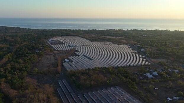 Aerial view of PLTS Bali Timur solar power plant in Indonesia. Aerial view of PLTS Bali Timur solar power plant in Indonesia.