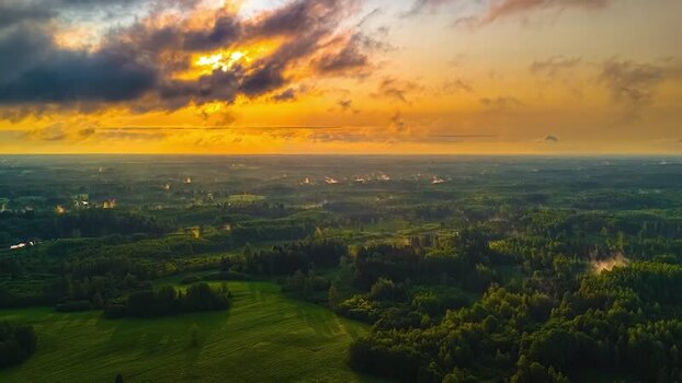 Aerial view of lush green forests and fields in Latvia. Aerial view of lush green forests and fields in Latvia.