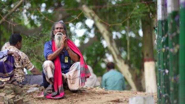 View of a man praying at Mahasthan in Bogura Bangladesh.