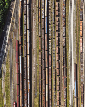 Aerial view of freight trains parked on parallel tracks in a railway yard in Saalfeld Thuringia Germany. Aerial view of freight trains parked on parallel tracks in a railway yard in Saalfeld Thuringia Germany.