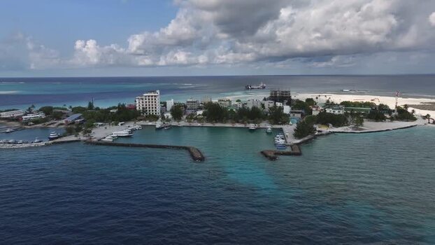 Aerial view of Gulhi island harbor and buildings Maldives. Aerial view of Gulhi island harbor and buildings Maldives.