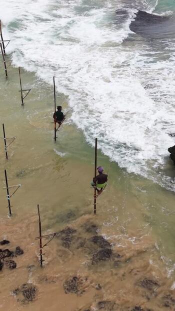 Aerial view of stilt fishermen in the ocean Sri Lanka. Aerial view of stilt fishermen in the ocean Sri Lanka.