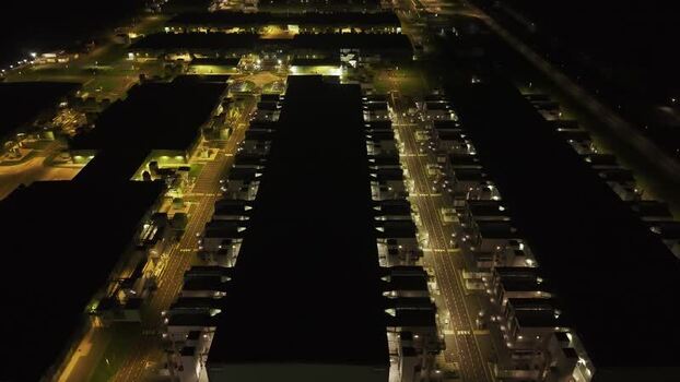 Aerial view of illuminated data center facility Netherlands.