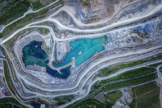 Aerial view of the Irish Cement Ltd quarry with turquoise water pools and winding roads in Drogheda County Louth Ireland. Aerial view of the Irish Cement Ltd quarry with turquoise water pools and winding roads in Drogheda County Louth Ireland.