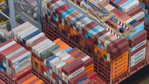 Corringham England United Kingdom 10 July 2026 Aerial view of Solent Stevedores London Gateway with stacks of colorful shipping containers and industrial gantry cranes at the busy port terminal.