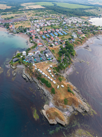 Aerial view of Arapya a coastal area with a rocky peninsula camping site beach and residential buildings along the Black Sea in Burgas Bulgaria. Aerial view of Arapya a coastal area with a rocky peninsula camping site beach and residential buildings along the Black Sea in Burgas Bulgaria.