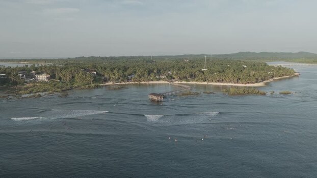 Aerial view of Cloud 9 Beach Club Siargao and surfers Philippines. Aerial view of Cloud 9 Beach Club Siargao and surfers Philippines.