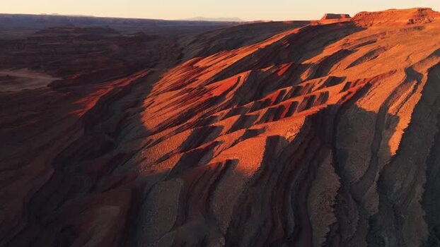 Aerial view of red rock formations and deep canyons United States.