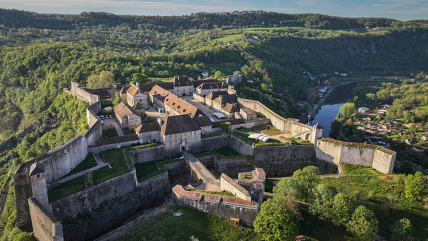 Aerial view of the historic Besancon Citadel with its massive stone fortifications and bastions overlooking the Doubs river in Besancon Bourgogne Franche Comte France. Aerial view of the historic Besancon Citadel with its massive stone fortifications and bastions overlooking the Doubs river in Besancon Bourgogne Franche Comte France.