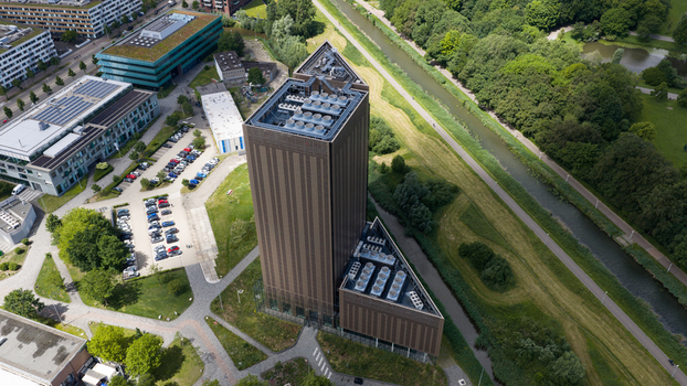 Amsterdam Netherlands 09 June 2026 Aerial view of Digital Realty Amsterdam AMS17 a modern triangular data center building surrounded by green spaces a canal and urban infrastructure. Amsterdam Netherlands 09 June 2026 Aerial view of Digital Realty Amsterdam AMS17 a modern triangular data center building surrounded by green spaces a canal and urban infrastructure.