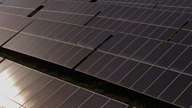 Aerial view of solar panels in a large photovoltaic farm Portugal. Aerial view of solar panels in a large photovoltaic farm Portugal.