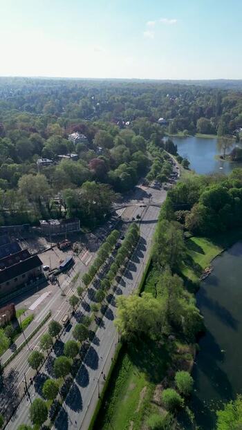 Aerial view of a tree lined avenue and a lake in Belgium. Aerial view of a tree lined avenue and a lake in Belgium.