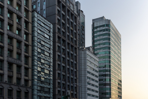 View of modern skyscrapers and residential buildings with glass facades under a clear sky in Taipei City Taiwan. View of modern skyscrapers and residential buildings with glass facades under a clear sky in Taipei City Taiwan.