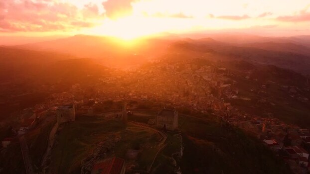 Aerial view of hilltop town at sunset in Sicily Italy.