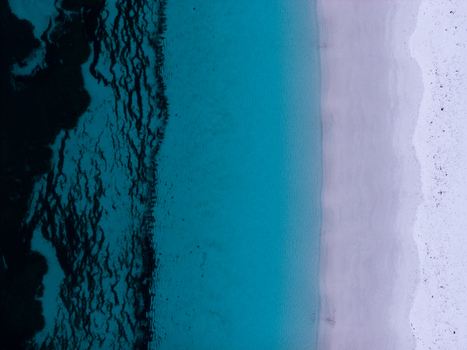 Aerial view of Frenchman Bay showing the contrast between the deep blue ocean turquoise shallows and white sandy beach in Albany Western Australia Australia. Aerial view of Frenchman Bay showing the contrast between the deep blue ocean turquoise shallows and white sandy beach in Albany Western Australia Australia.