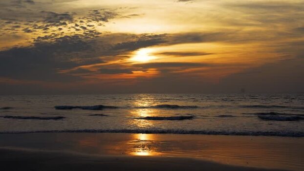 View of the golden sunset over the beach in Bangladesh. View of the golden sunset over the beach in Bangladesh.