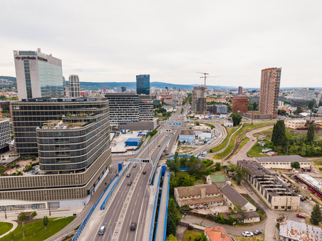 Aerial view of the modern business district skyline with office buildings a highway overpass and construction cranes in Bratislava Bratislava Region Slovakia. Aerial view of the modern business district skyline with office buildings a highway overpass and construction cranes in Bratislava Bratislava Region Slovakia.