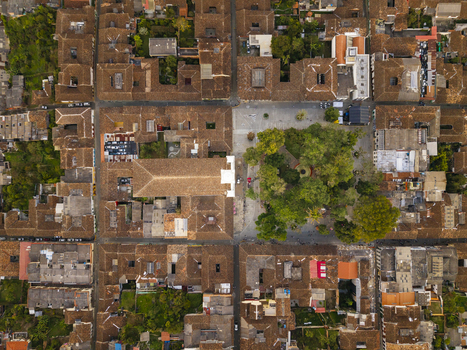 Aerial view of terracotta rooftops meeting the verdant plaza at the heart of the town creating a stunning contrast in texture and tone Salamina Caldas Colombia. Aerial view of terracotta rooftops meeting the verdant plaza at the heart of the town creating a stunning contrast in texture and tone Salamina Caldas Colombia.