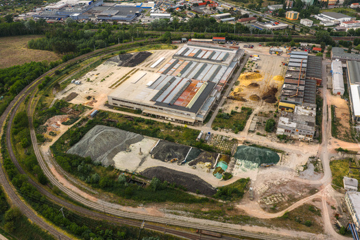 Aerial view of the Tepelna elektrarna Hodonin power station with industrial buildings storage yards and railway tracks in Hodonin Jihomoravsky kraj Czechia. Aerial view of the Tepelna elektrarna Hodonin power station with industrial buildings storage yards and railway tracks in Hodonin Jihomoravsky kraj Czechia.