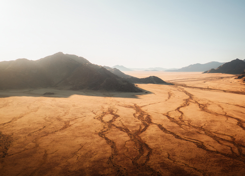 Aerial view of the D707 desert landscape with dry riverbeds and mountains in the Karas Region Namibia.