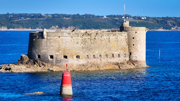 Aerial view of the imposing Château du Taureau fortress rises from the vivid blue waters a stone sentinel against the horizon Plouezoc h Bretagne France. Aerial view of the imposing Château du Taureau fortress rises from the vivid blue waters a stone sentinel against the horizon Plouezoc h Bretagne France.
