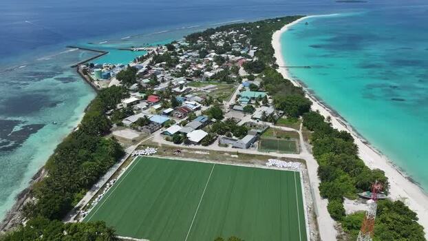 Aerial view of a tropical island with a sports field Maldives. Aerial view of a tropical island with a sports field Maldives.