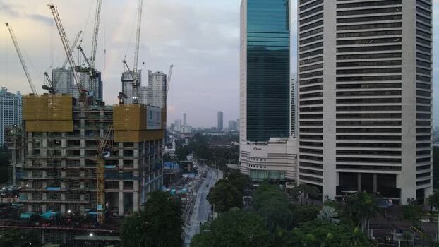 Aerial view of construction sites and skyscrapers in Indonesia. Aerial view of construction sites and skyscrapers in Indonesia.