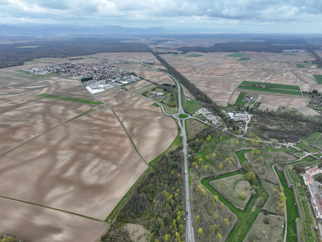 Aerial view of the star shaped fortress of Neuf Brisach a testament to Vauban s military architecture surrounded by fields forests and roads Grand Est France.