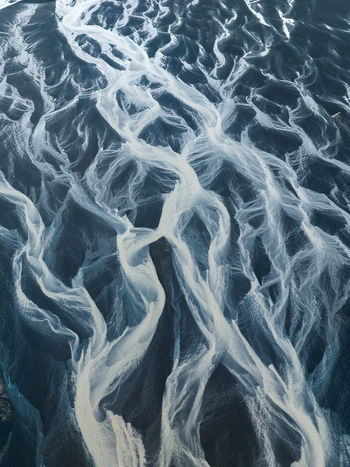 Aerial view of glacial rivers weaving intricate patterns across the volcanic plains creating a stunning display of nature s artistry Iceland Iceland. Aerial view of glacial rivers weaving intricate patterns across the volcanic plains creating a stunning display of nature s artistry Iceland Iceland.