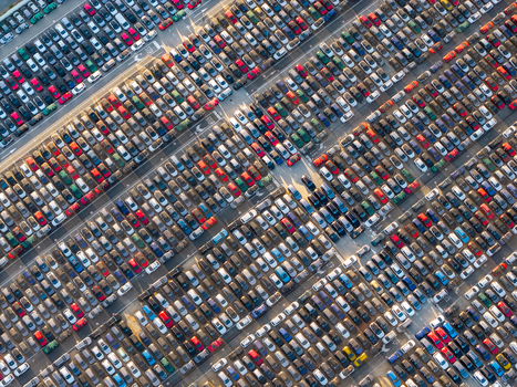Aerial view of a vast parking lot at Civitavecchia Port filled with numerous new cars arranged in neat rows in Civitavecchia Lazio Italy. Aerial view of a vast parking lot at Civitavecchia Port filled with numerous new cars arranged in neat rows in Civitavecchia Lazio Italy.