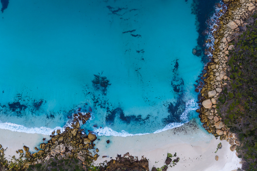 Aerial view of Bettys Beach featuring turquoise water white sand and rocky coastline in Albany WA Australia. Aerial view of Bettys Beach featuring turquoise water white sand and rocky coastline in Albany WA Australia.