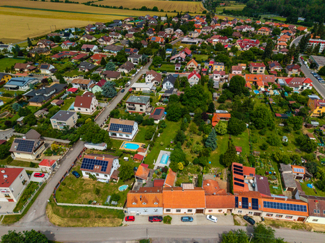 Aerial view of a residential neighborhood in Tocnik with houses gardens swimming pools and solar panels on rooftops in Tocnik Stredocesky kraj Czechia. Aerial view of a residential neighborhood in Tocnik with houses gardens swimming pools and solar panels on rooftops in Tocnik Stredocesky kraj Czechia.