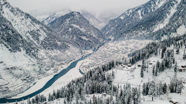 Aerial view of a snow laden valley with the Neelum River snaking through the mountainous landscape Sharda Azad Kashmir Pakistan. Aerial view of a snow laden valley with the Neelum River snaking through the mountainous landscape Sharda Azad Kashmir Pakistan.