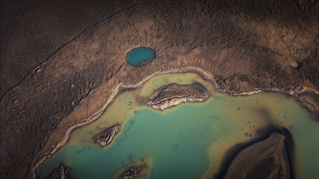 Aerial view of turquoise glacial lakes surrounded by dark volcanic sand and abstract earth patterns in Vik Myrdalshreppur Iceland. Aerial view of turquoise glacial lakes surrounded by dark volcanic sand and abstract earth patterns in Vik Myrdalshreppur Iceland.